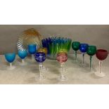 A selection of coloured glassware to include a bowl, scallop dish and various glasses