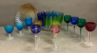 A selection of coloured glassware to include a bowl, scallop dish and various glasses