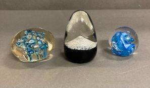 Three paperweights to include Caithness Eagle