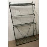 A four tier wrought iron bakers rack, possibly French (H210cm W121cm D47cm)