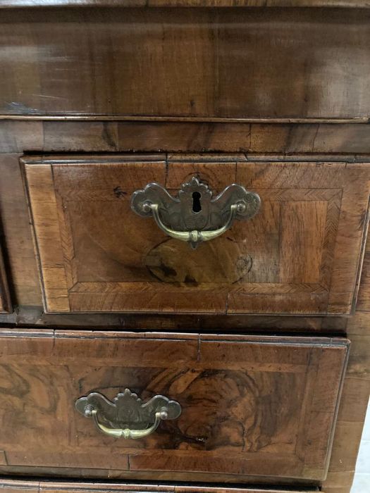 An 18th Century walnut veneered chest on stand with three short and three long drawers and brass - Image 3 of 6