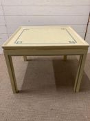 A light green painted side table with gold piping and blue geometric details (H51cm W66cm D66cm)