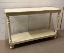 A white painted console table with turned supports and turned feet (H86cm W130cm D41cm)