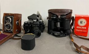 A Zenit TTL camera, Sem or Mac view finder, lens and a cased set of binoculars
