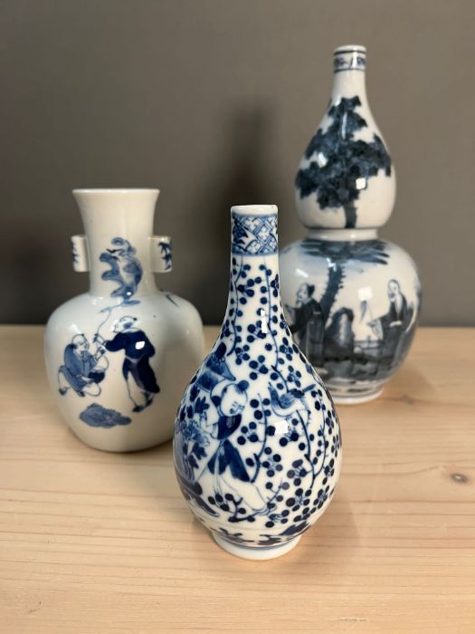 Three blue and white vases