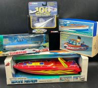 A selection of toy boats and one Corgi Diecast plane