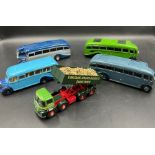 Four vintage Diecast model buses and a tipper lorry