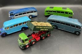 Four vintage Diecast model buses and a tipper lorry