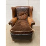 A leather Art Deco wing back arm chair in the style of Zimmer AF