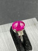 A vintage ruby on platinum ring with single stone diamond shoulders. Size L