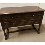 An oak low sideboard with three drawers (H76cm W106cm D48cm)