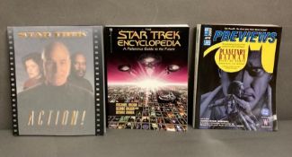 A comic shop catalog and two Star Trek reference books