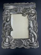 A Japanese antique dragon themed picture frame in white metal (24.5cm x 18.5cm)