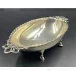 A hallmarked silver bowl on four hoof feet, approximate total weight 80g, Birmingham 1911.