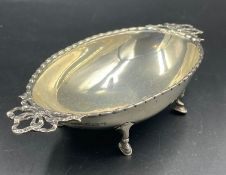 A hallmarked silver bowl on four hoof feet, approximate total weight 80g, Birmingham 1911.
