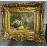 A still life of fruit in a heavy gilt ormate frame 49cm x 40cm, signed bottom right.