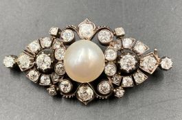 A Victorian 1880 silver and gold Pearl and Diamond brooch. Natural Salt Water pearl size 10.6 x 10.2