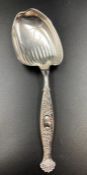A Sterling silver serving spoon with shell handle by WHITING MANUFACTURING COMPANY