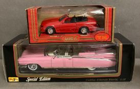 Two boxed Diecast cars, a Cadillac Eldorado and a Mercedes 500SL