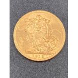 A 1912 gold sovereign coin.