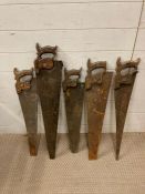A selection of five vintage hand saws