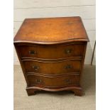 A serpentine fronted Bevan burr walnut reproduction chest of drawers (H67cm W53cm D42cm)