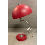 A red mushroom head table lamp