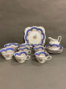 A part plant tea set to include cups, saucers and sugar jug