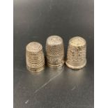 A selection of three silver thimbles