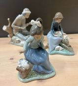 Three Nao figurines, all with animals