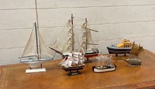 Six model boats on plinths to include The Amsterdam and a Lifeboat