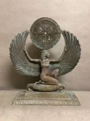 A mantle clock depicting the Egyptian goddess Isis, Time pieces missing