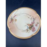 A Royal Worcester blush ivory side plate with floral decoration