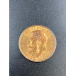 A 1912 gold sovereign coin.