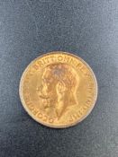 A 1912 gold sovereign coin.