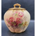 A Royal Worcester blush ivory lidded jar with floral decoration