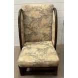 A low wingback fire side chair