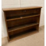 An oak two shelf bookcase (H93cm W110cm D26cm)