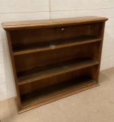 An oak two shelf bookcase (H93cm W110cm D26cm)