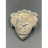 A Wilson and Sharp silver badge, hallmarked for Edinburgh, featuring George and the Dragon.