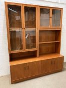 G-Pan wall unit consisting of a glazed display unit or bookcase, shelves and cupboards under
