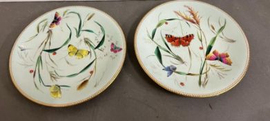 Two hand painted porcelain plates decorated with butterflies