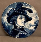 A blue and white charger depicting The Artist Rembrandt