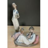Two Lladro figurines of a nurse and a mother with child