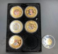 A selection of five collectable Princess Diana themed coins, along with a 2007 sovereign