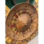 A mid century fairground odds and evens turn table. Diameter 126cm