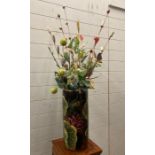 A plant pot/umbrella stand with glazed floral design