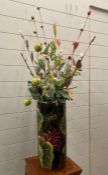 A plant pot/umbrella stand with glazed floral design