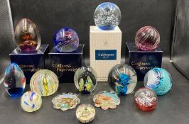 A selection of paperweight to include Caithness