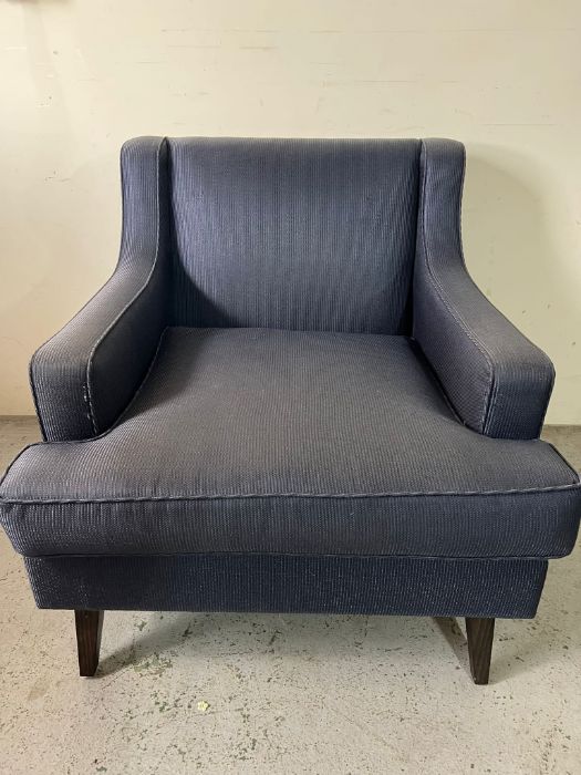 A contemporary chair in a navy pin stripe fabric (H85cm W86cm D80cm)